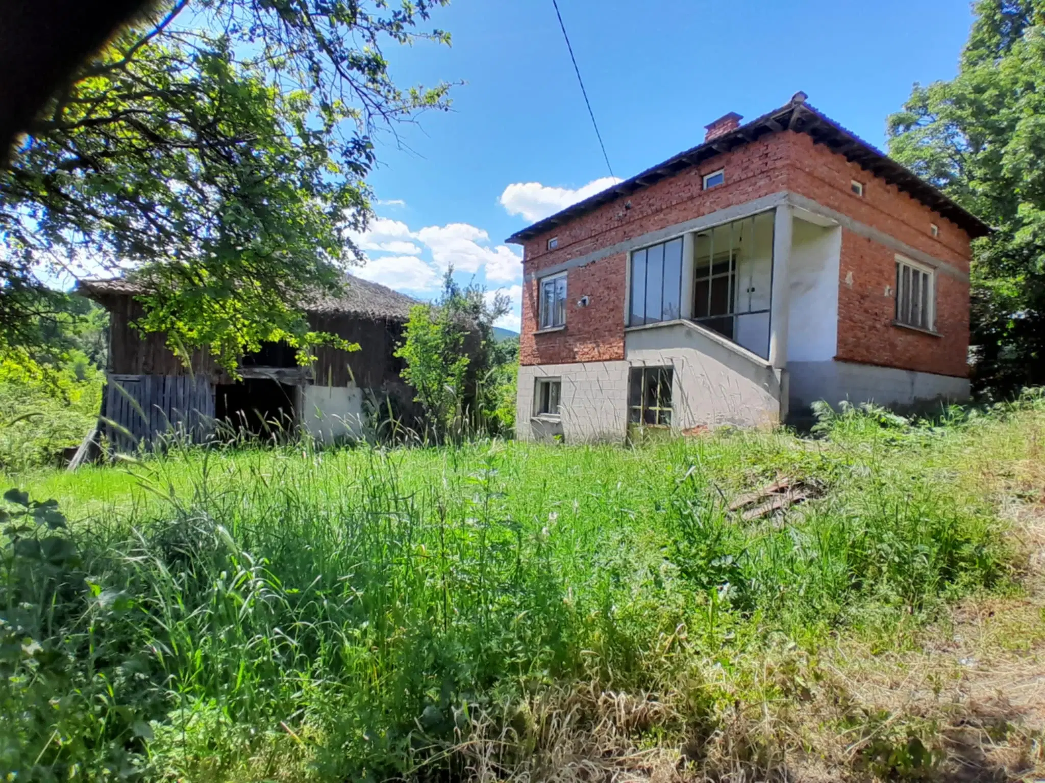 Woning aan de rivier met bijgebouw en 1.100 m² grond in Podgore, Vidin - Bulgarije