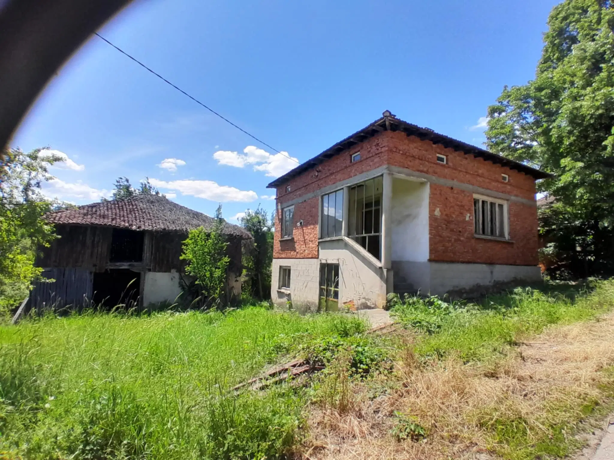 Woning aan de rivier met bijgebouw en 1.100 m² grond in Podgore, Vidin - Bulgarije